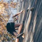 person climbing mountain