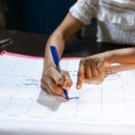 person planning budget with laptop